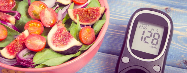 Vintage photo, Fruit and vegetable salad and glucose meter, concept of diabetes and healthy nutrition