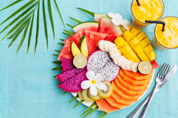 Tropical fruits assortment with mango smoothie
