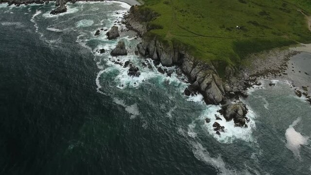 From above Giant waves mountains cliff. Far East marine reserve. Vladivostok unique national Park best of Russia nature. Stormy dark clouds. Epic cinematic aerial drone flight 4k ultrahd.