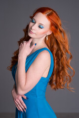 Naklejka premium Young woman with long red hair