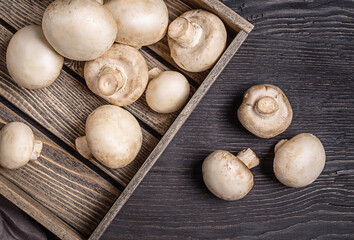 Champignons in a wooden box.