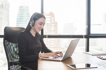 Asian businesswoman using laptop for work, Portrait business concept, 20-30 year old.