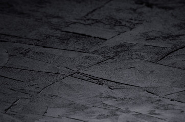 Dark grey grunge rough concrete texture wall.