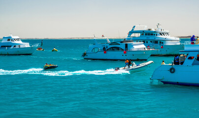 El Gouna/Egypt - April 11, 2015: Sea attraction, happy people ride the inflatable watercraft boat