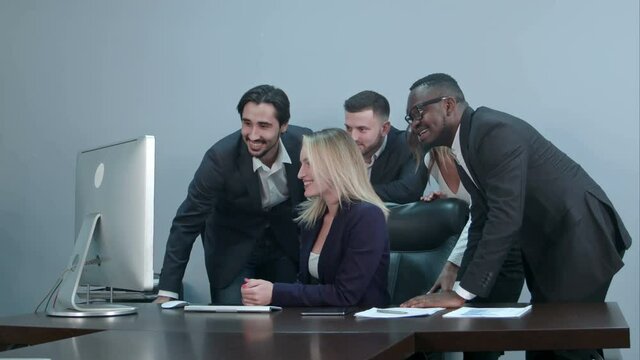 Group of multiracial businesspeople together videoconferencing at workplace
