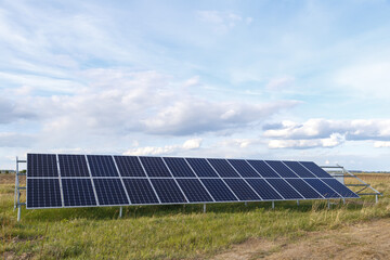 Fototapeta premium Solar panel produces green, environmentally friendly energy from the sun