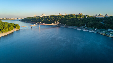 Aerial top view of pedestrian Park bridge and Dnieper river from above, city of Kiev, Ukraine

