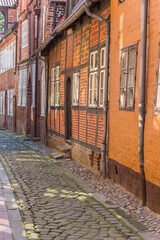 Cobblestones street with old houses in Luneburg