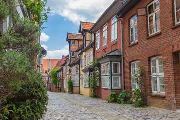 Fototapeta na wymiar Colorful street with old houses in Luneburg