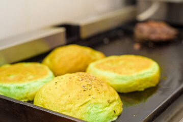 Preparing bun for hamburger