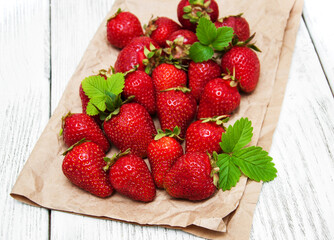 ripe strawberries on wooden table