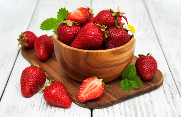 ripe strawberries on wooden table