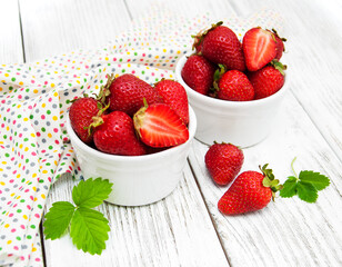 ripe strawberries on wooden table