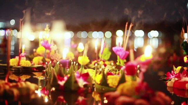 Loy Kratong Festival celebrated in Thailand. Launch boats from beautiful flowers and candles in the pond. 1920x1080. hd