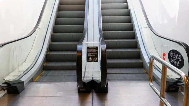 Moving escalator up in a public area. UltraHD stock footage.