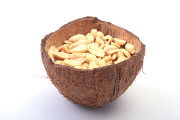 Roasted peeled peanuts in Handmade bowl of coconut, Selective Focus