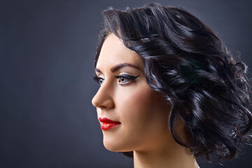 Fototapeta premium Beautiful brunette woman with perfect hairstyle and professional makeup