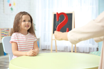 Little girl with teacher on private lesson