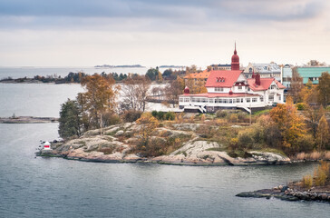 HELSINKI, FINLAND - October 13, 2016: View from idyllic island with nice building in coast of Helsinki. Cloudy day.