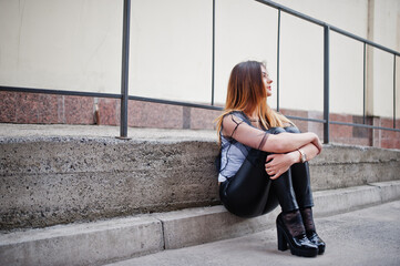 Fashionable woman look at white shirt, black transparent clothes, leather pants, posing at street...