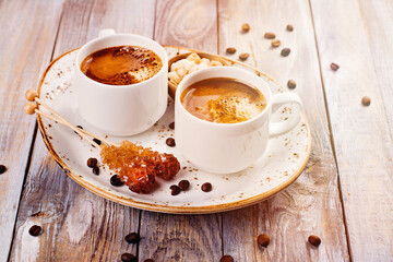 Coffee cups on wooden table