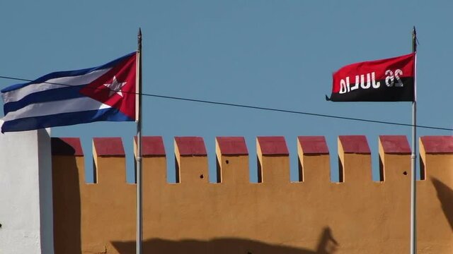 Flag of Cuba flies on a windy day over Moncada Barracks in Santiago of Cuba