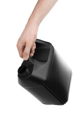 Human hand pouring out oil from black plastic jerrycan on white background