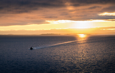 Scenic landscape with sunset and sea at evening in Gulf Of Finland