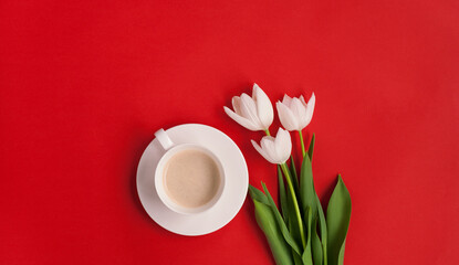 Fototapeta na wymiar Coffee and flowers on red