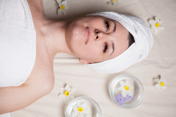 beautiful woman lies in the sauna spa relax