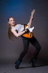 Girl with guitar at the rehearsal before the performance