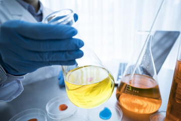 Researchers are looking at the liquid in the flask