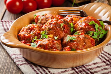 Pork meatballs with spicy tomato sauce in dish