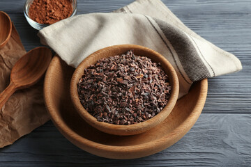 Composition with cocoa nibs on wooden table