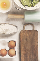 Top view on cooking ingredients and vintage kitchen accessories