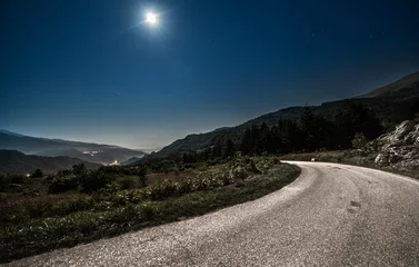 Foto auf Acrylglas mountain road in the night with full moon in background. © darkside17