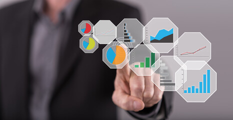 Fototapeta premium Man touching a graphic analysis concept on a touch screen