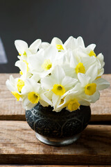 bouquet of narcissuses in vintage vase.style rustic