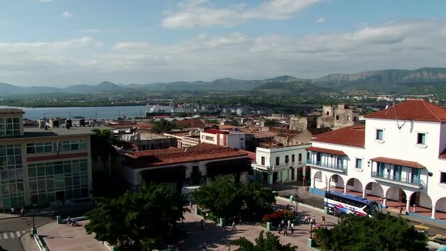 Shot of Cespedes Park and City Hall in Santiago de Cuba. Sierra Maestra mountain range on the background