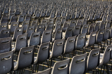 Empty grey plastic seats in St Peters Square , Vatican City