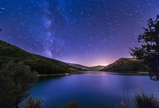 purple night sky stars lake landscape with milky way on mountain background