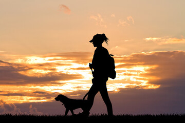girl with dog at sunset
