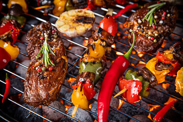 Barbecue grill with beef steaks, close-up.