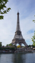 Fototapeta na wymiar Photo of Eiffel Tower on a spring cloudy morning, Paris, France