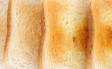 Crusty toast background close-up.
