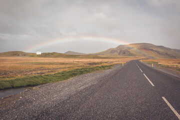 Fototapeta na wymiar Rainbow and Endless Icelandic Highway