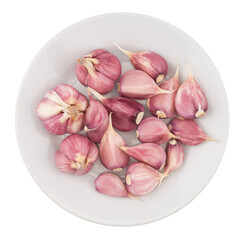 Garlic in a white plate. Isolated on white background.