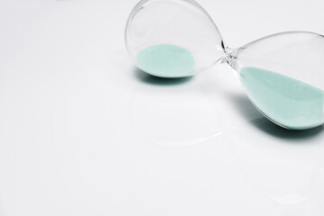 Old hourglass on white background.