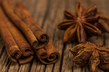 Star anise and cinnamon on old wooden table.