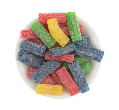 Gummy Sweet And Sour Candy In A Bowl Top View Isolated On A White Background.